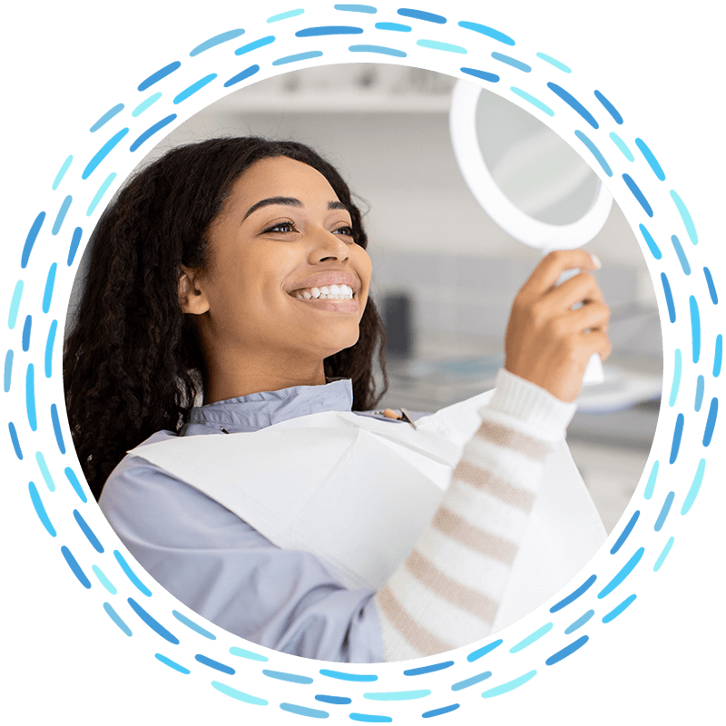 smiling dental patient with mirror